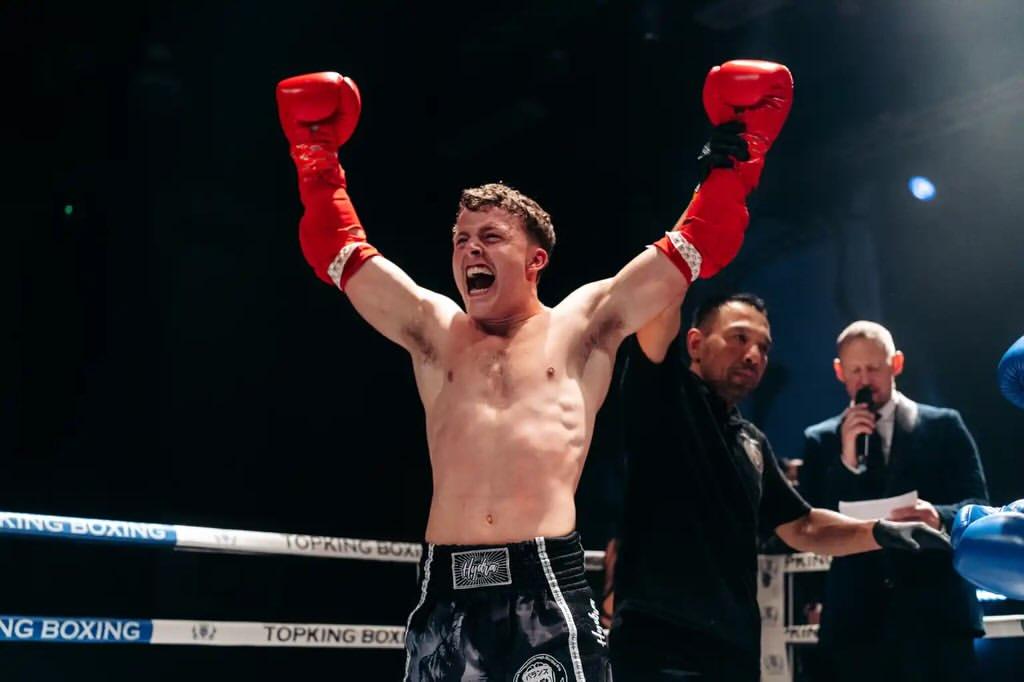 A PDMA fighter celebrating a win in the ring
